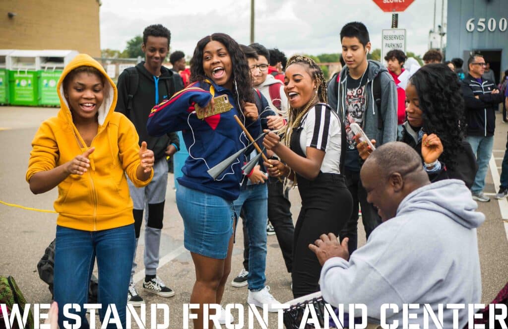 students and staff celebrating