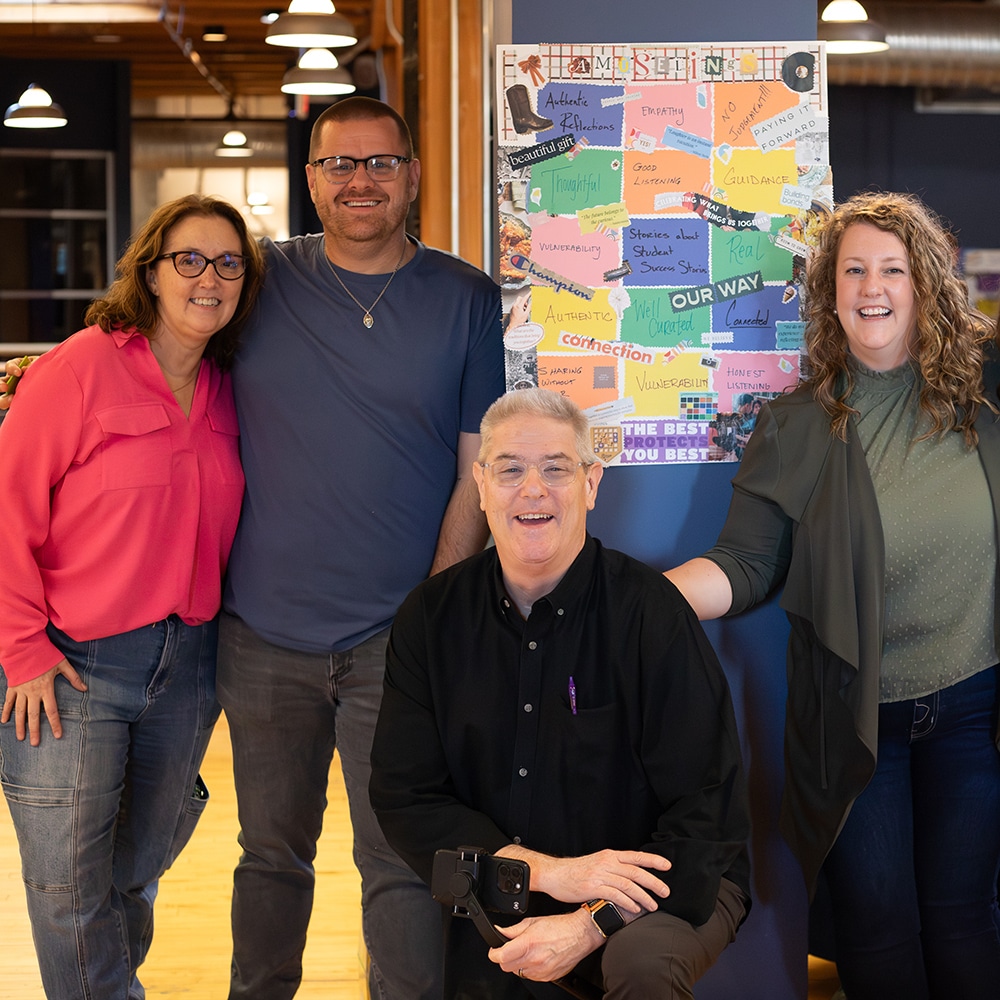 Four CESO Communication team members smiling at the camera